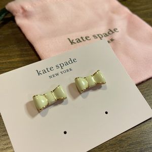 Kate Spade “Take a Bow” Enamel Stud Bow Earrings in Ivory and Gold
